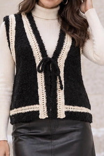 BLACK SWEATER VEST W CREAM TRIM AND TIE IN FRONT