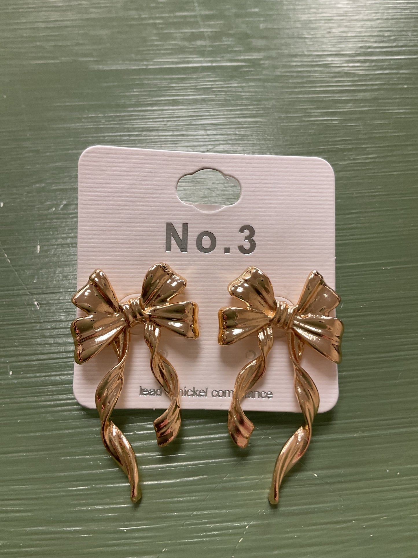 GOLD LONG BOW TEXTURED EARRINGS