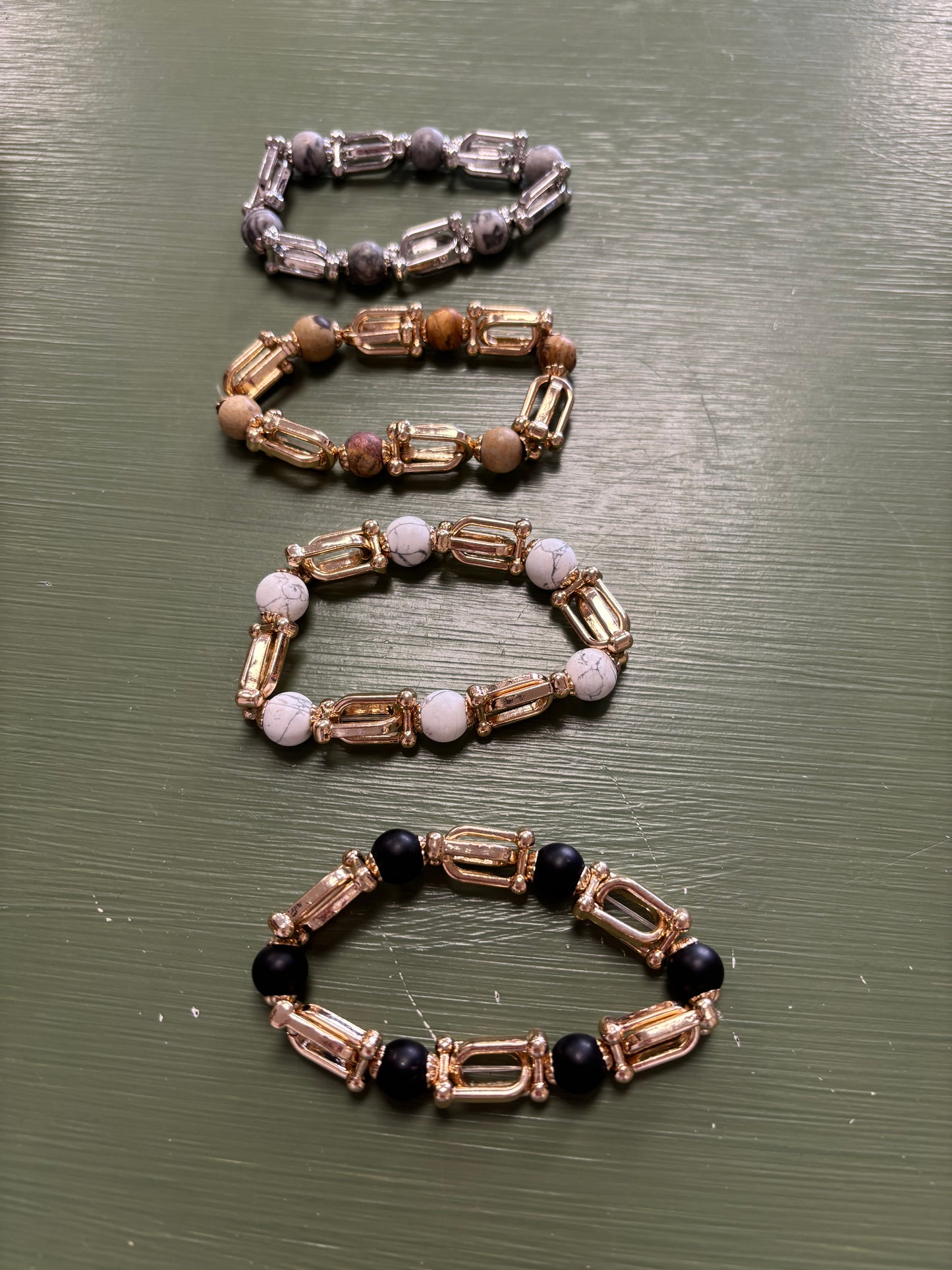 GOLD OR SILVER RINGS WITH COLORED STONES BETWEEN