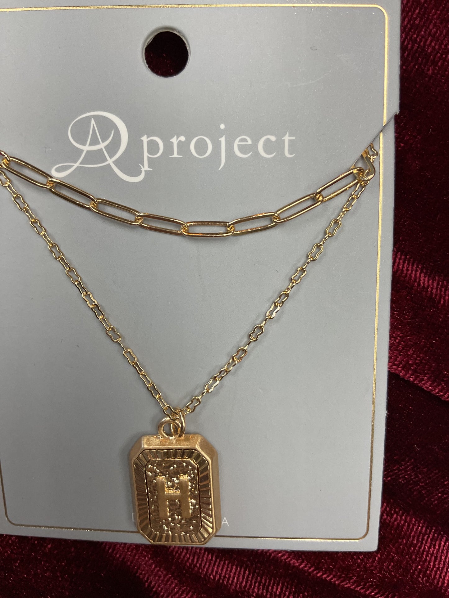 Double gold initial H