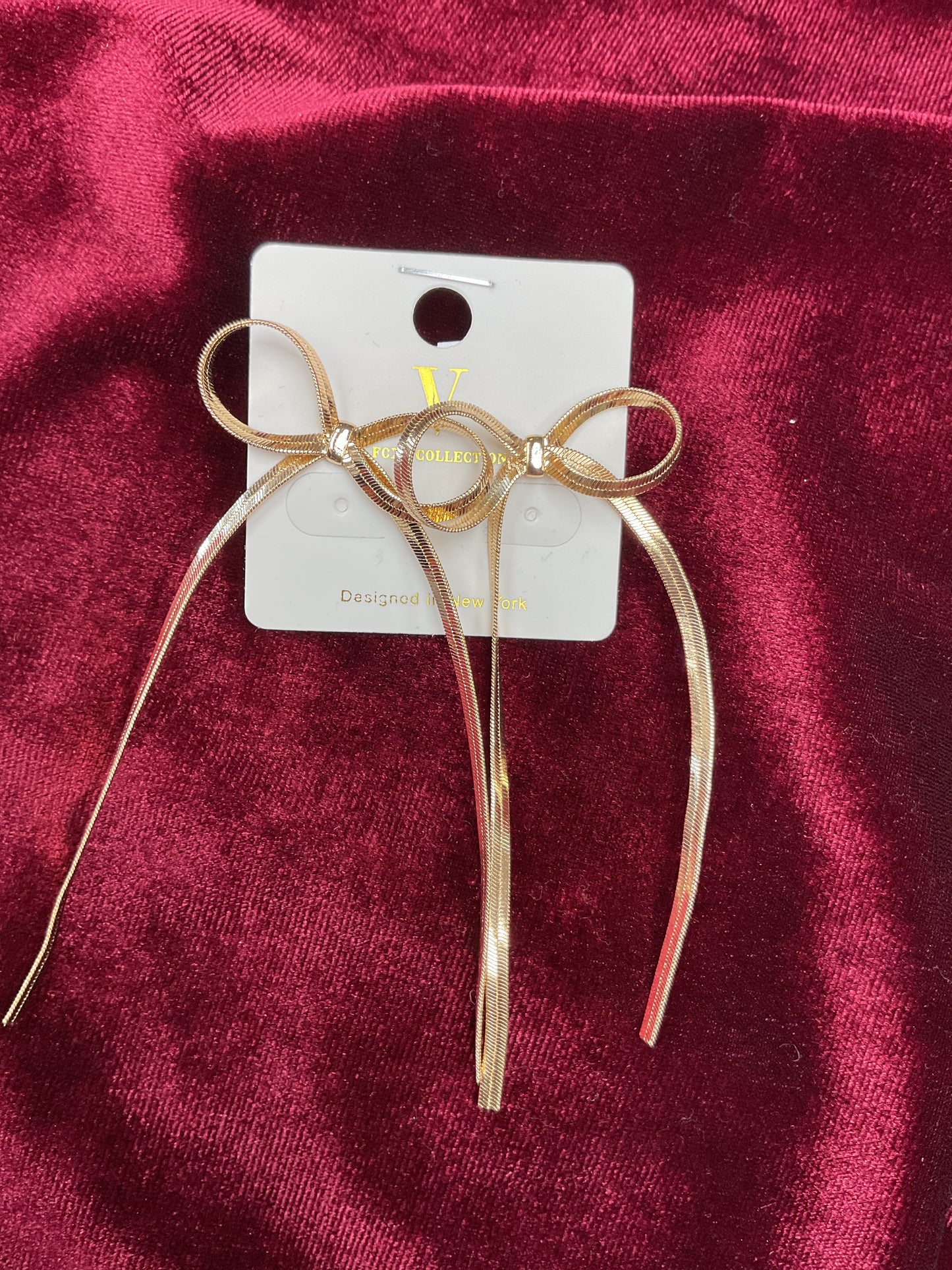 Gold hanging bow earrings