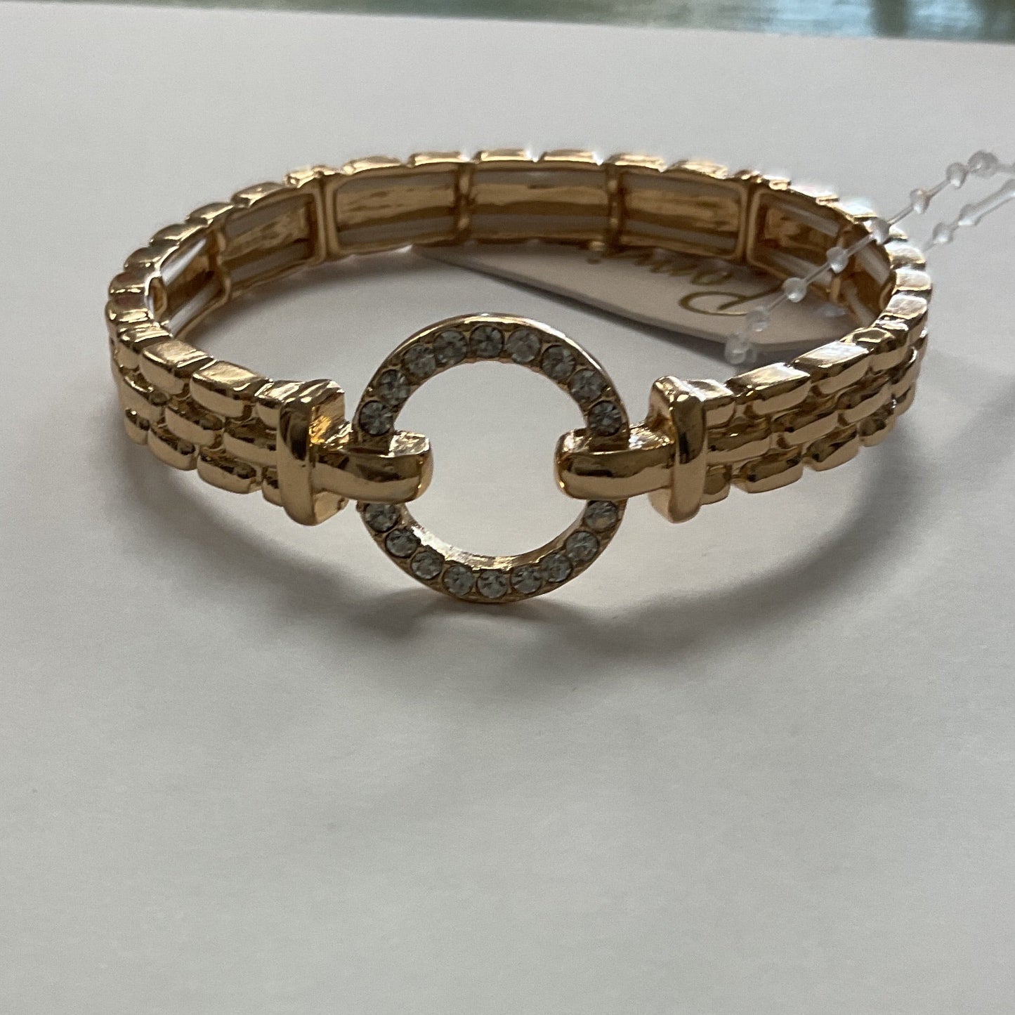 Gold stretch bracelet with rhinestone open circle