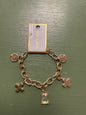 Gold charm bracelet, gem, cross, circle pendant