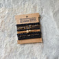 BLACK AND BROWN HAIR TIES WITH GOLD AND BLACK GEMS