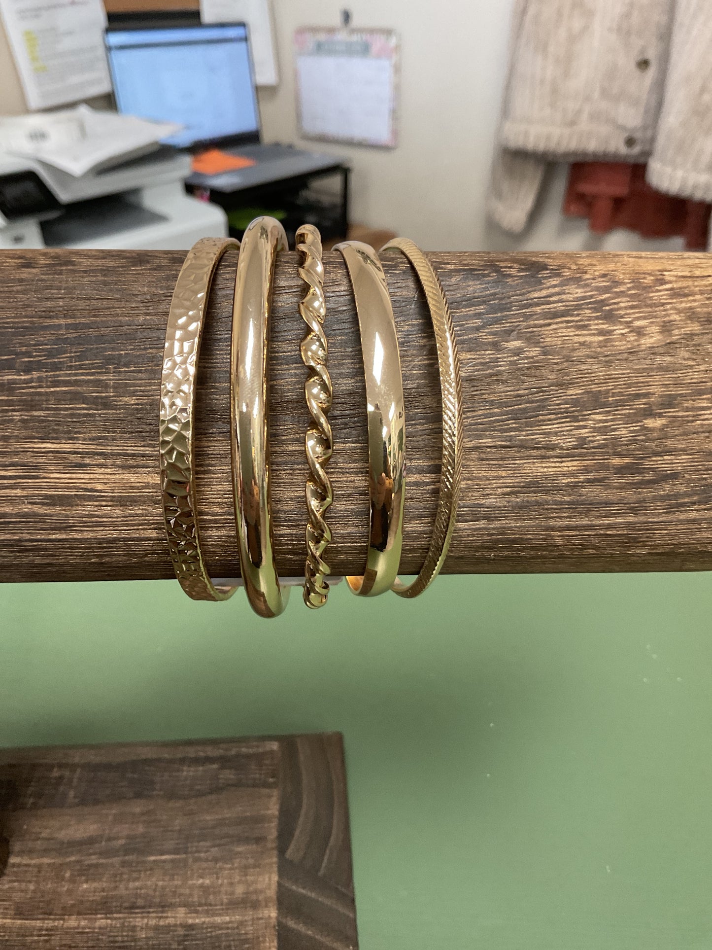 SET OF FIVE THIN TEXTURED GOLD BANGLE BRACELETS