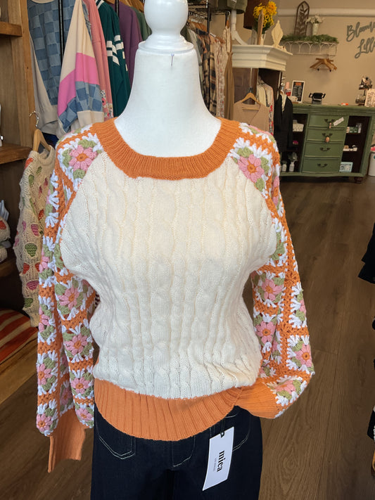 CREAM SWEATER WITH ORANGE TRIM AND CROCHET SLEEVES WITH FLOWERS
