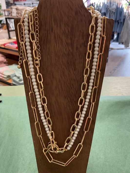 Gold and pearl triple necklace
