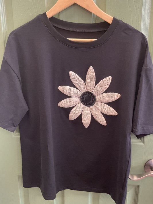 Black T-shirt with cream, crochet flower