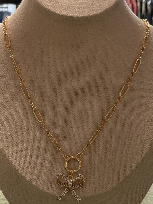 Gold chain necklace w/ gemstone bow charm w/ stud earrings
