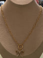 Gold chain necklace w/ gemstone bow charm w/ stud earrings