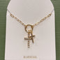 gold cross with double cross charms