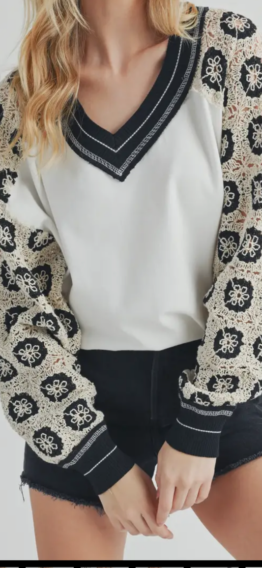 White crochet sleeved with black and cream top