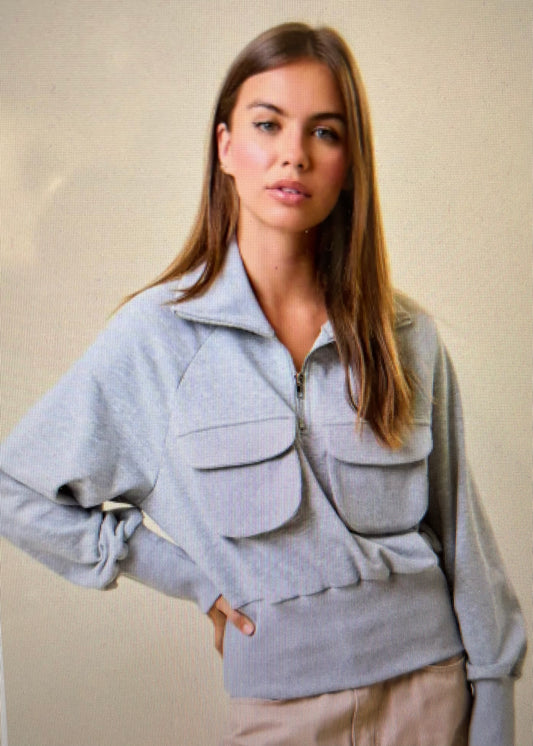 Gray cropped sweatshirt with zip collar and front pockets