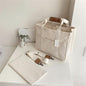 CANVAS CROSSBODY LAPTOP TOTE