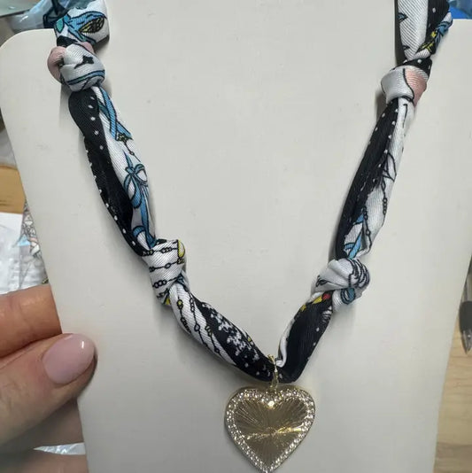 NAVY AND WHITE KNOTTED SCARF WITH HEART CHARM
