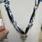NAVY AND WHITE KNOTTED SCARF WITH HEART CHARM