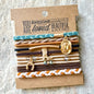 RUSTIC NEUATURAL BRAIDED HAIRTIE BRACLETS FEATURE A COWGIRL CHARM SET AGAINST AN ENCURAGING MESSAGE CARD