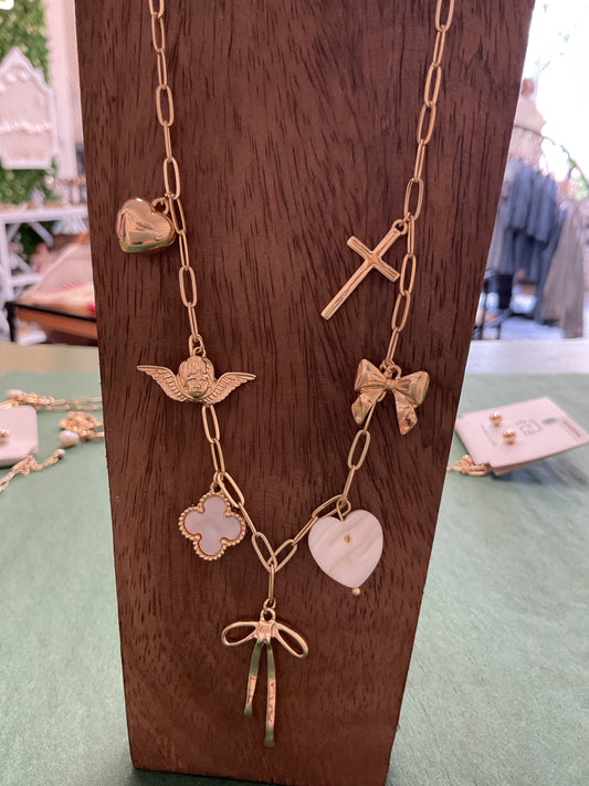 Gold charm necklace with bow/hearts/cross/clover