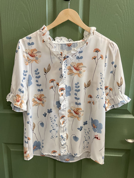 Short sleeved, white flowered silk ruffle top