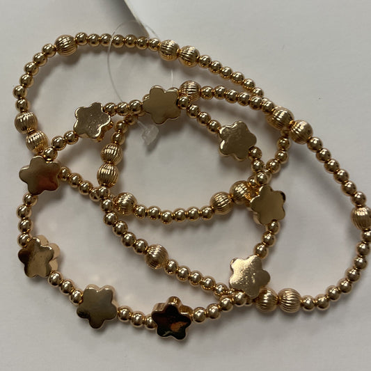 Gold stretchy bracelet with flowers, triple
